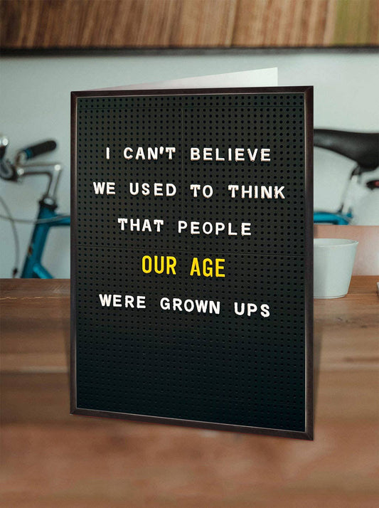 Letter board with humorous text on a wooden surface