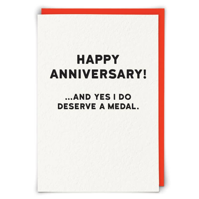 Greeting card with 'Happy Anniversary! ...and yes I do deserve a medal.' text on a white background with a red border.