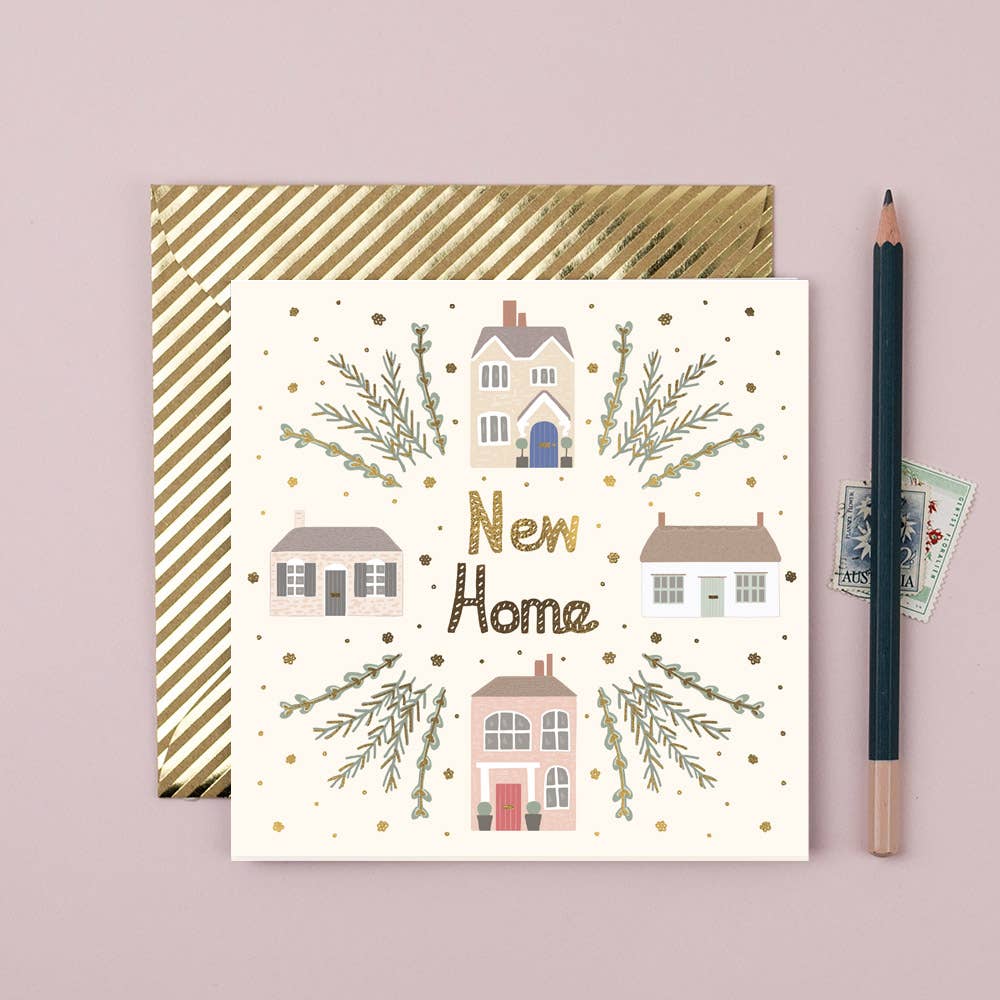 A greeting card with a house and shrub illustration and the text 'NEW HOME' on it, accompanied by a pencil and a stamp on a pink background.