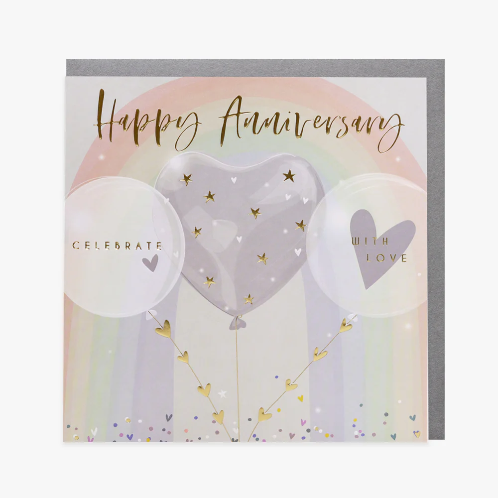 A greeting card with 'Happy Anniversary' text, embossed design, gold foil accents, a balloon illustration, and a rainbow background. The card also features the words 'Celebrate With Love' and has a silver envelope.