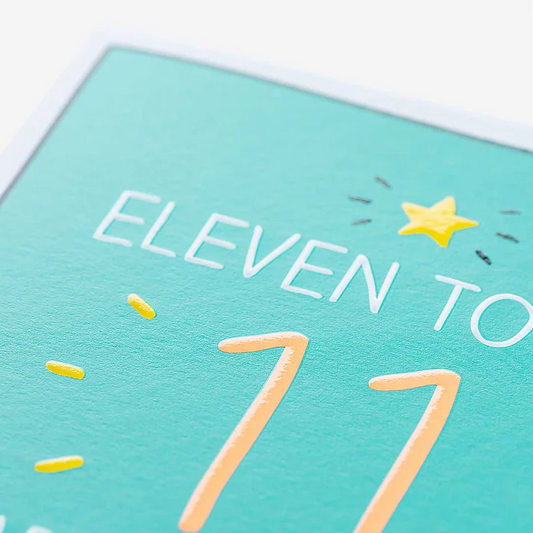 Teal card with 'Eleven to 77' text and yellow accents on a white background