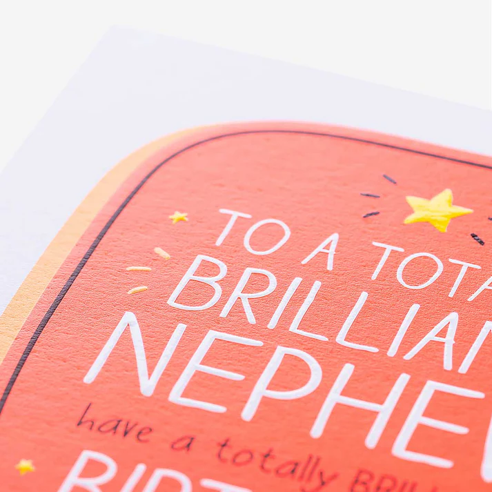 Card with text 'To a totally brilliant nephew' on a pink background