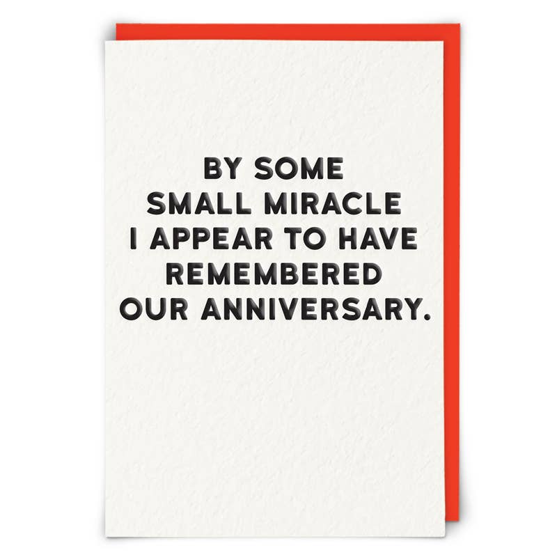 Card with humorous anniversary message on a white background with a red border