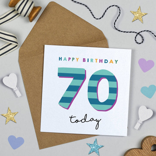 Birthday card with 'Happy Birthday 70 today' text on a decorative background with ribbons and stars.