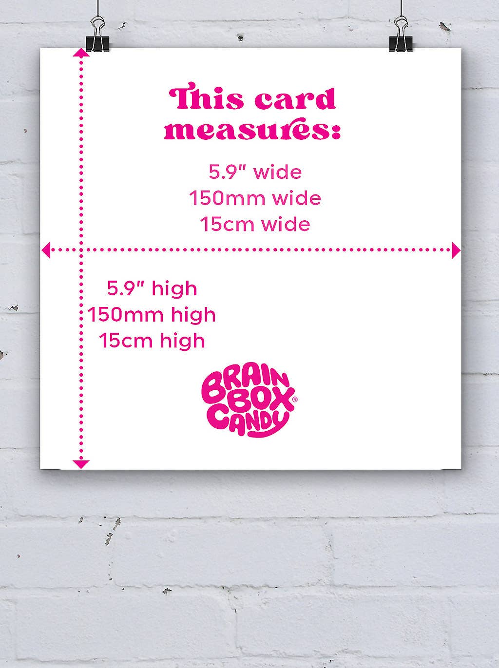 Measurement card with dimensions and 'Brain Box Candy' logo on a white brick wall background