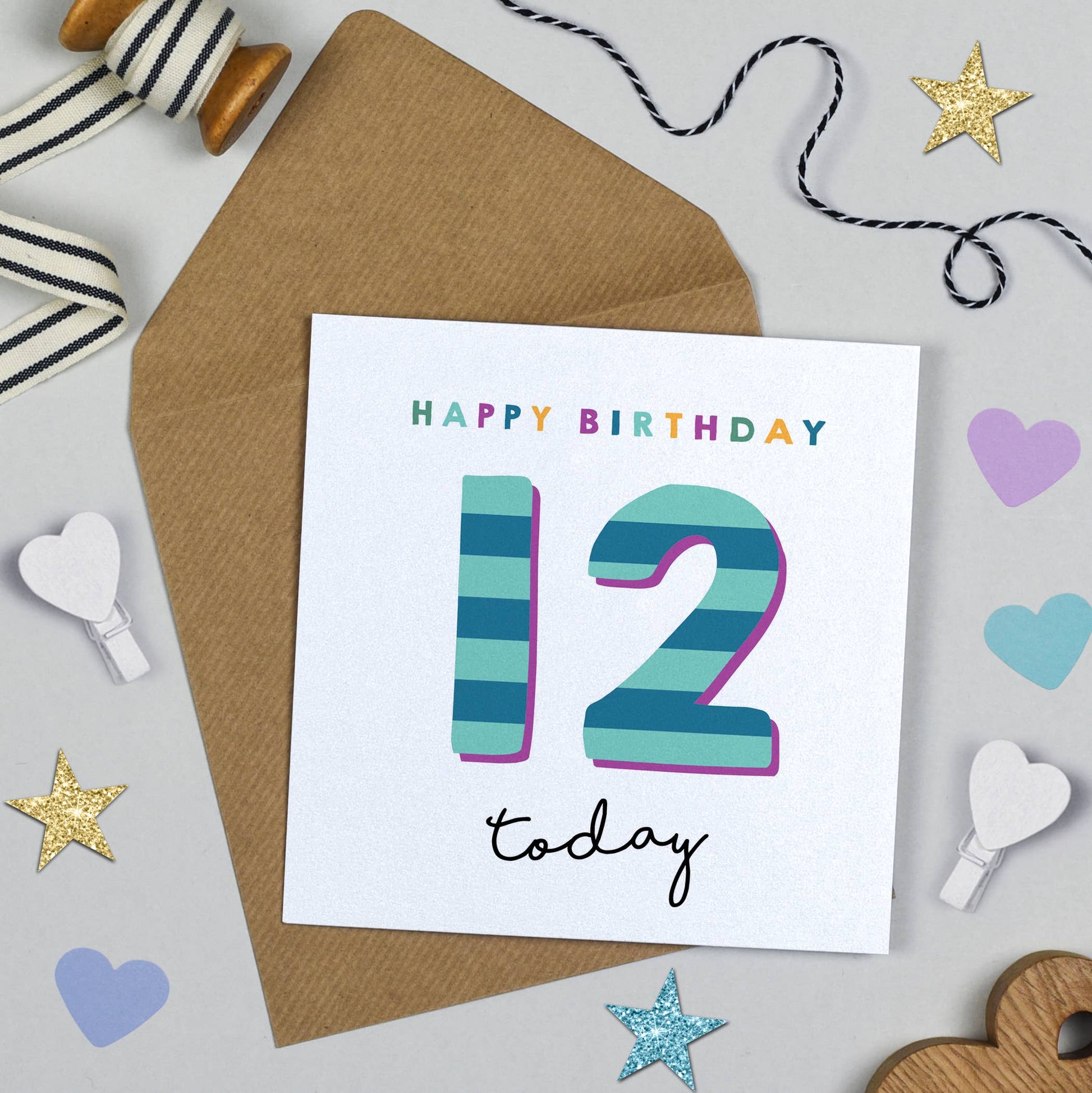 Birthday card with 'Happy Birthday 12 today' text on a white background with decorative items.