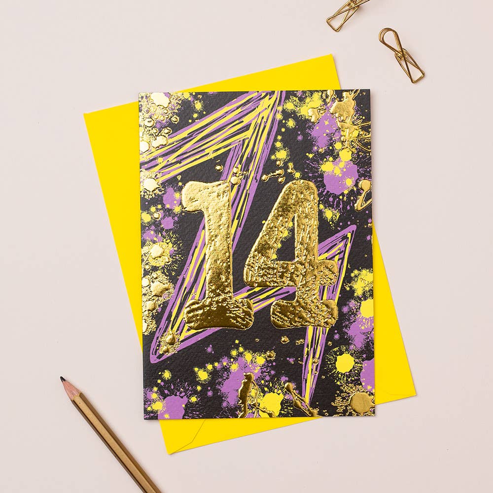 A colorful birthday card with the number 14 in gold foil, accompanied by a yellow envelope and a pen, displayed on a white background.