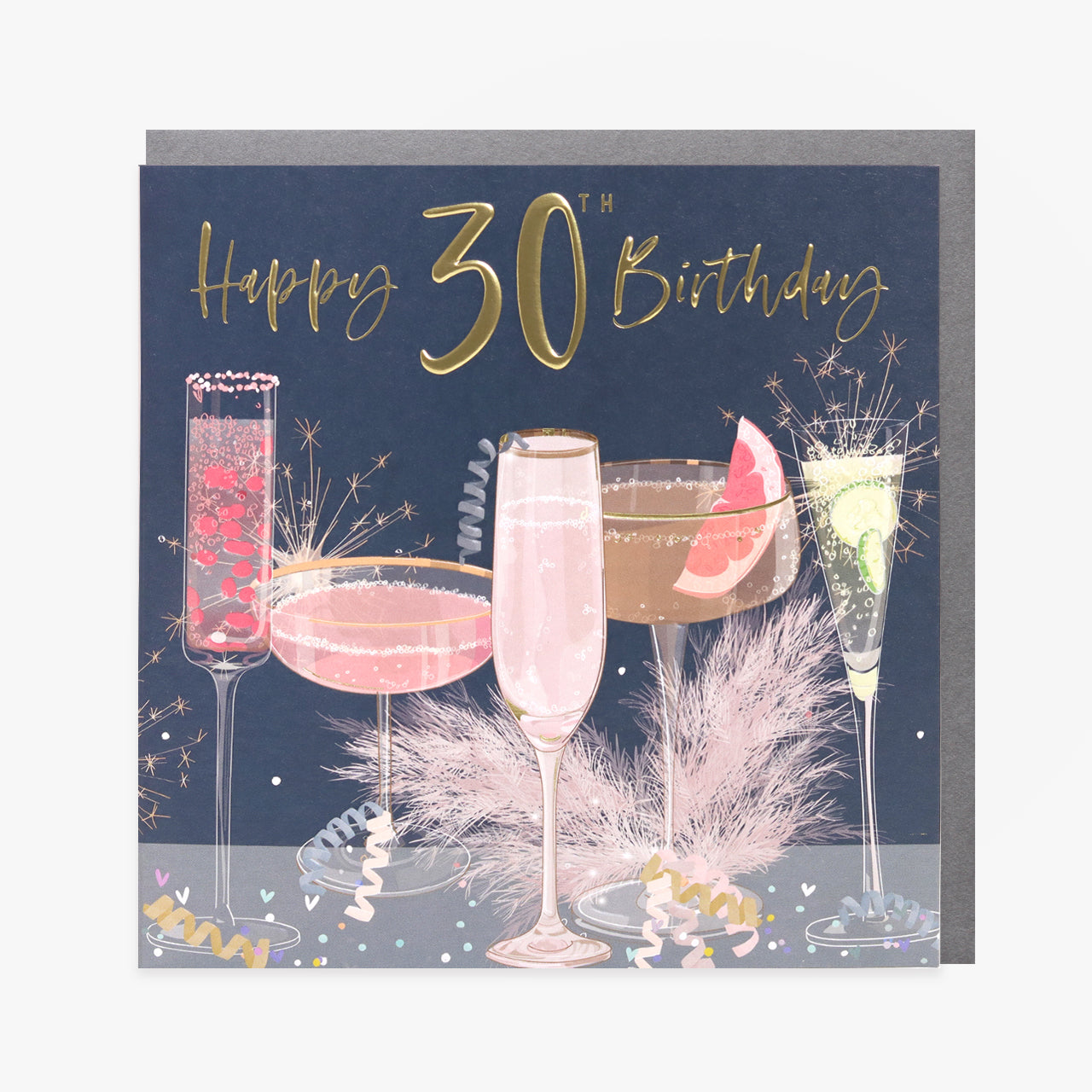A greeting card with a 30th birthday theme, featuring images of champagne glasses, a cake, and decorations with gold foiling and embossing.