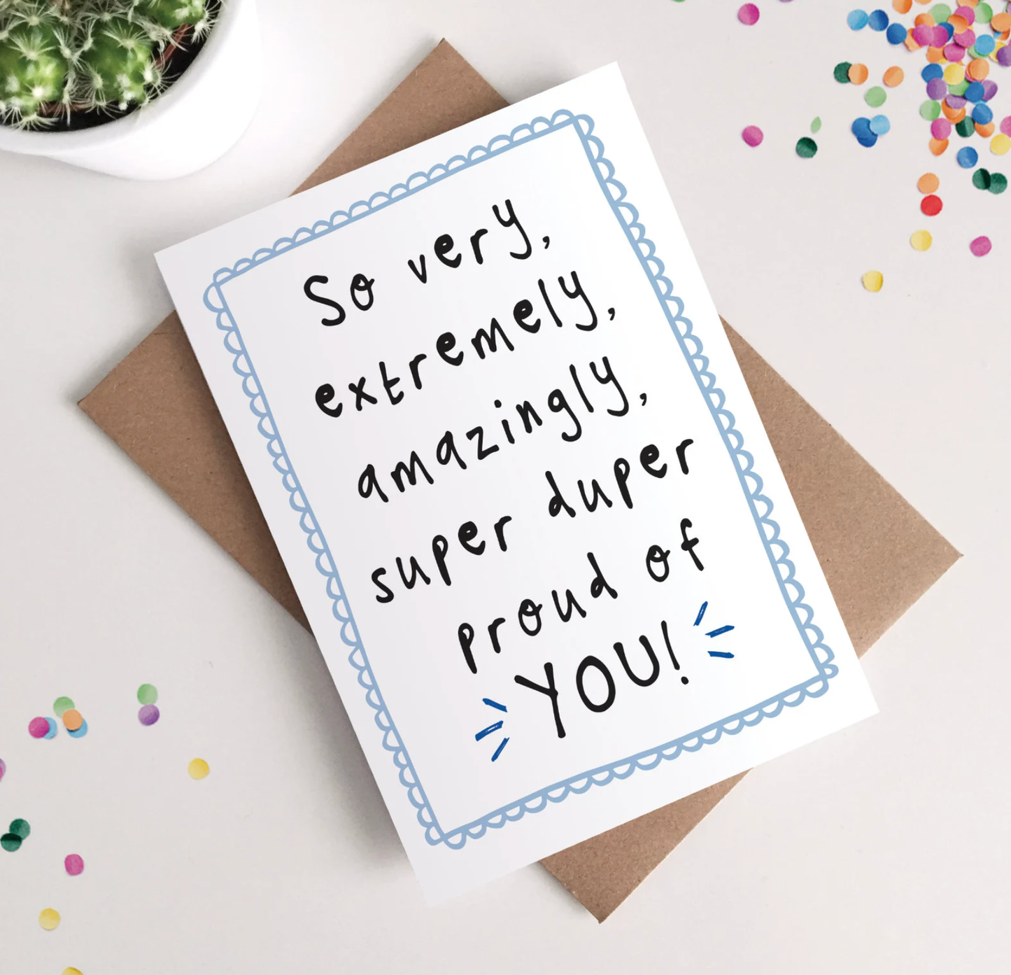 Greeting card with celebratory message on a white background with confetti.