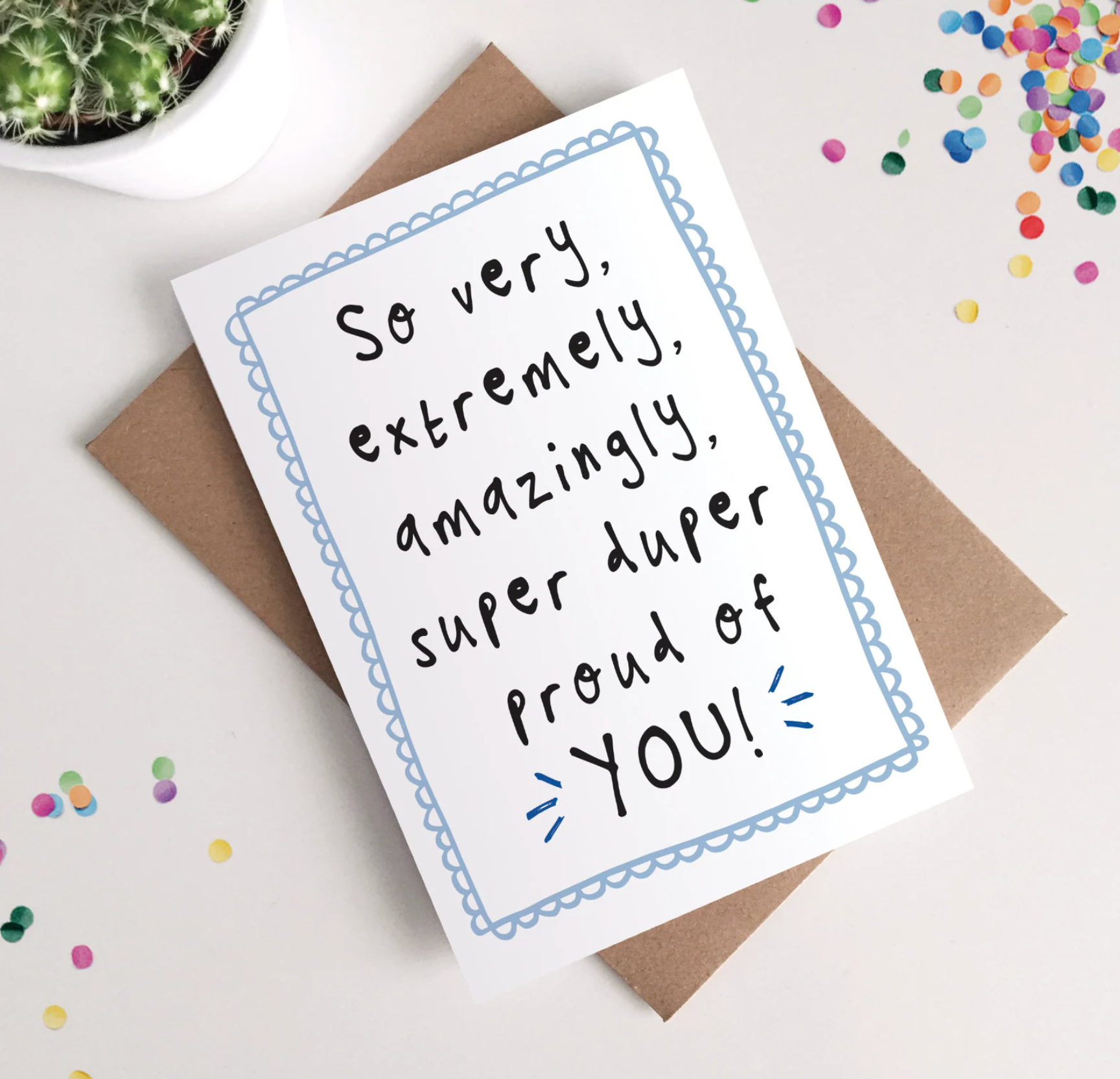 Greeting card with celebratory message on a white background with confetti.