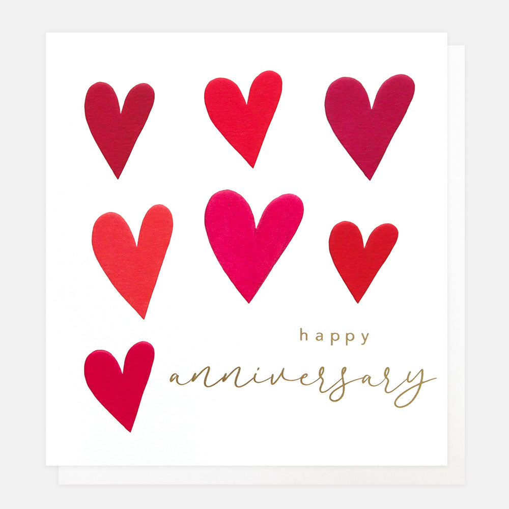 Card with red hearts and 'happy anniversary' text on a white background