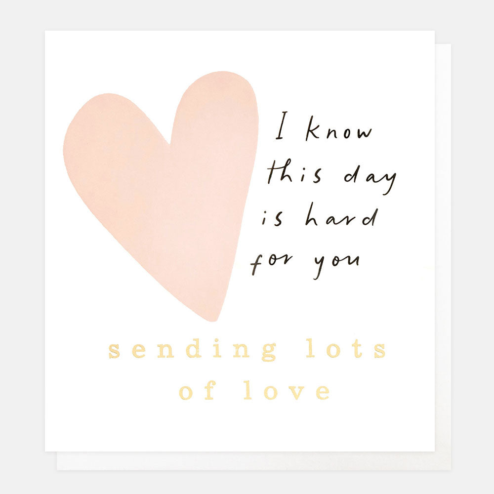 Heart-shaped card with text on a white background