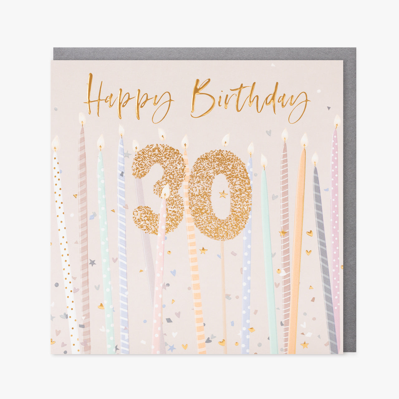 A cream card with tall candles and a gold 30 candle in the middle.  Gold writing saying "Happy Birthday" is at the top.  We can see a silver envelope inside.