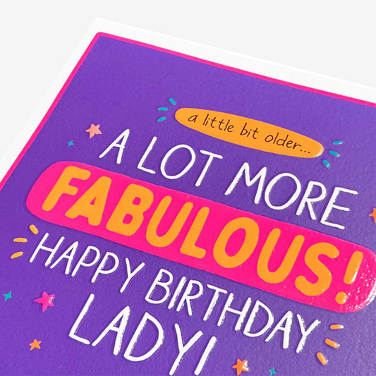 Birthday card with colorful text on a purple background