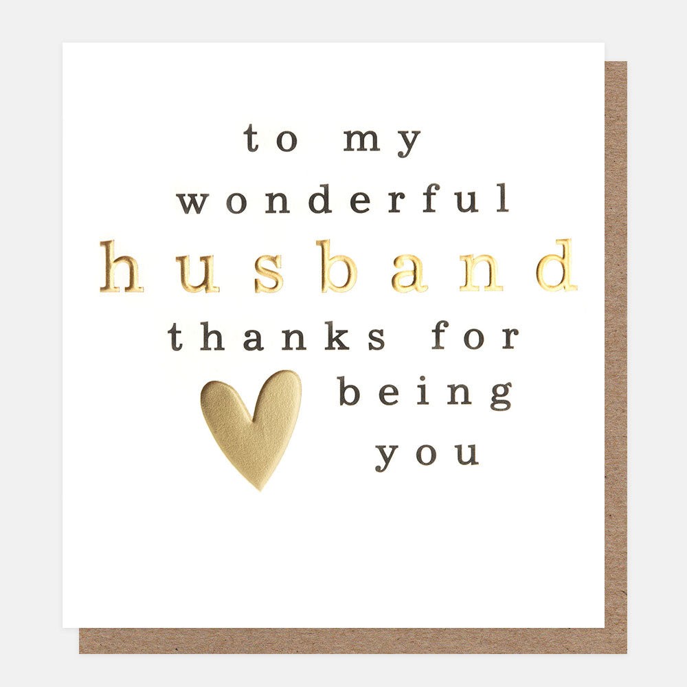 Greeting card with text 'to my wonderful husband thanks for being you' and a heart symbol on a white background.