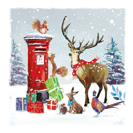 Red postbox with Christmas presents, deer, and other animals in a snowy scene.