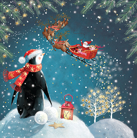 Illustration of a penguin with Santa Claus and reindeer sleigh in a snowy scene.