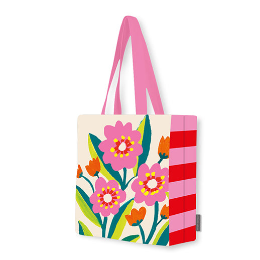 Tote bag with floral design and pink handles on a white background