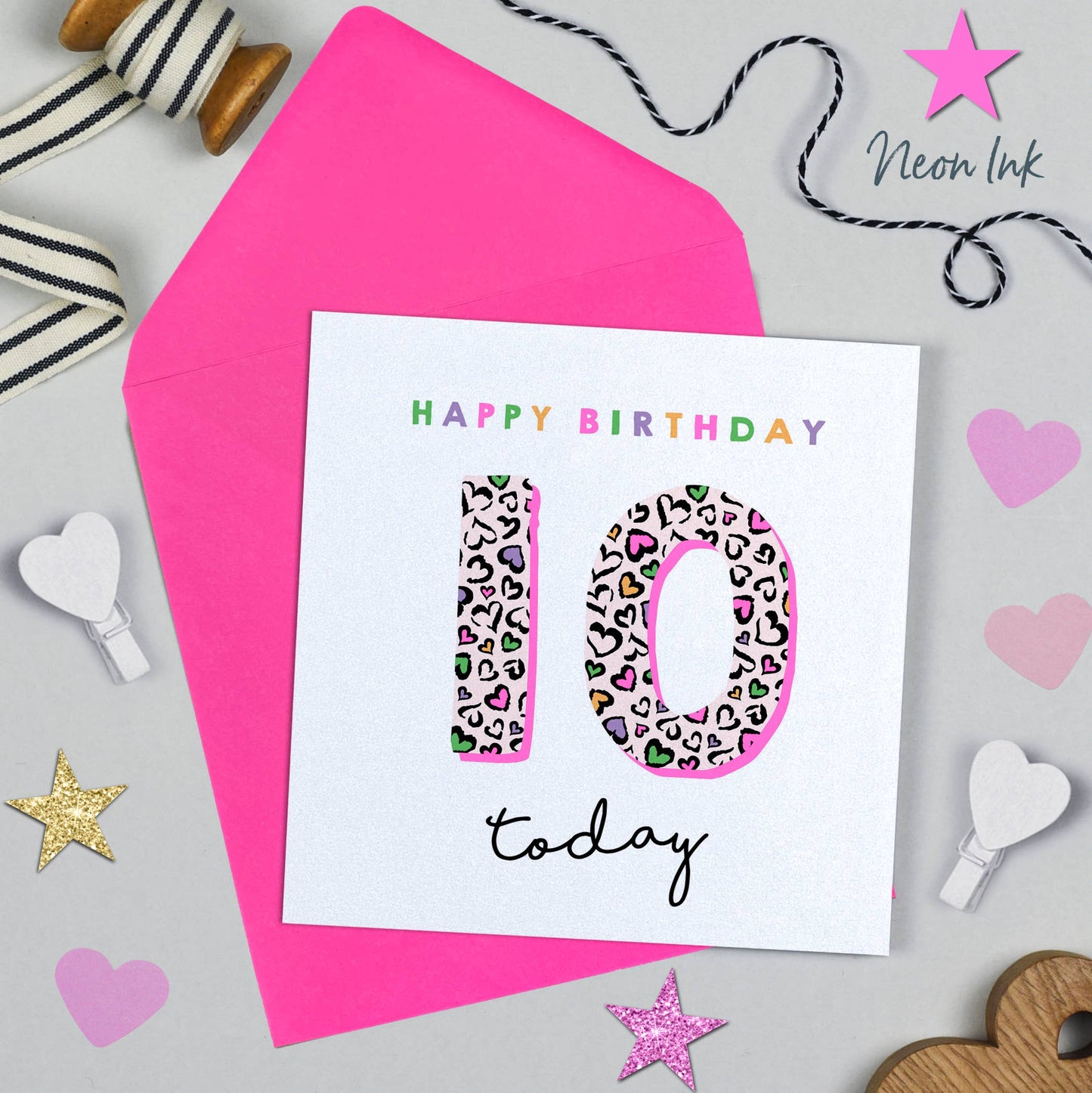 Birthday card with leopard print number 10 and 'Happy Birthday today' text on a pink envelope.
