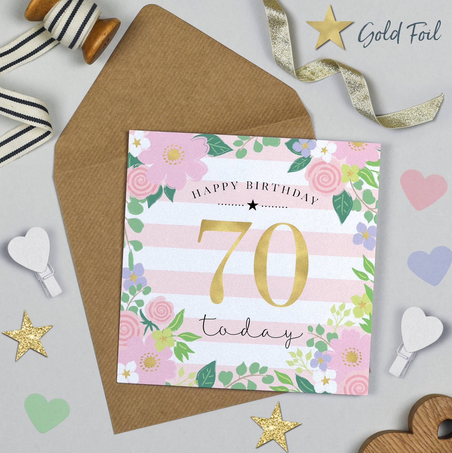 50th birthday card with floral design and gold foil text on a gray background