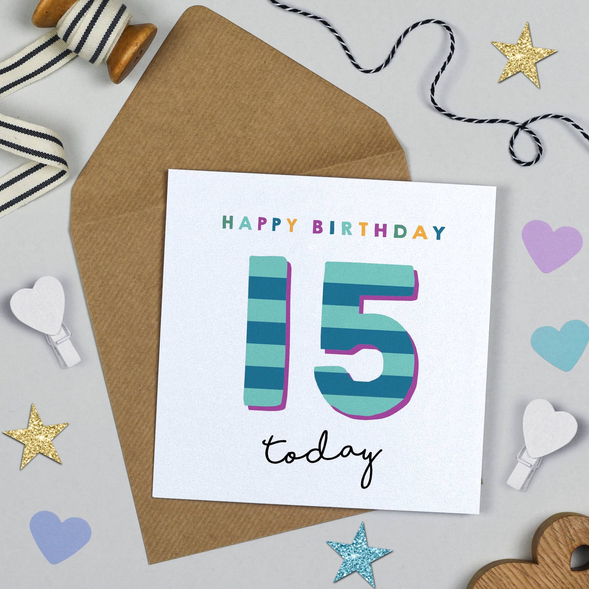 Birthday card with 'Happy Birthday 15 today' text on a decorative background with ribbons and stars.