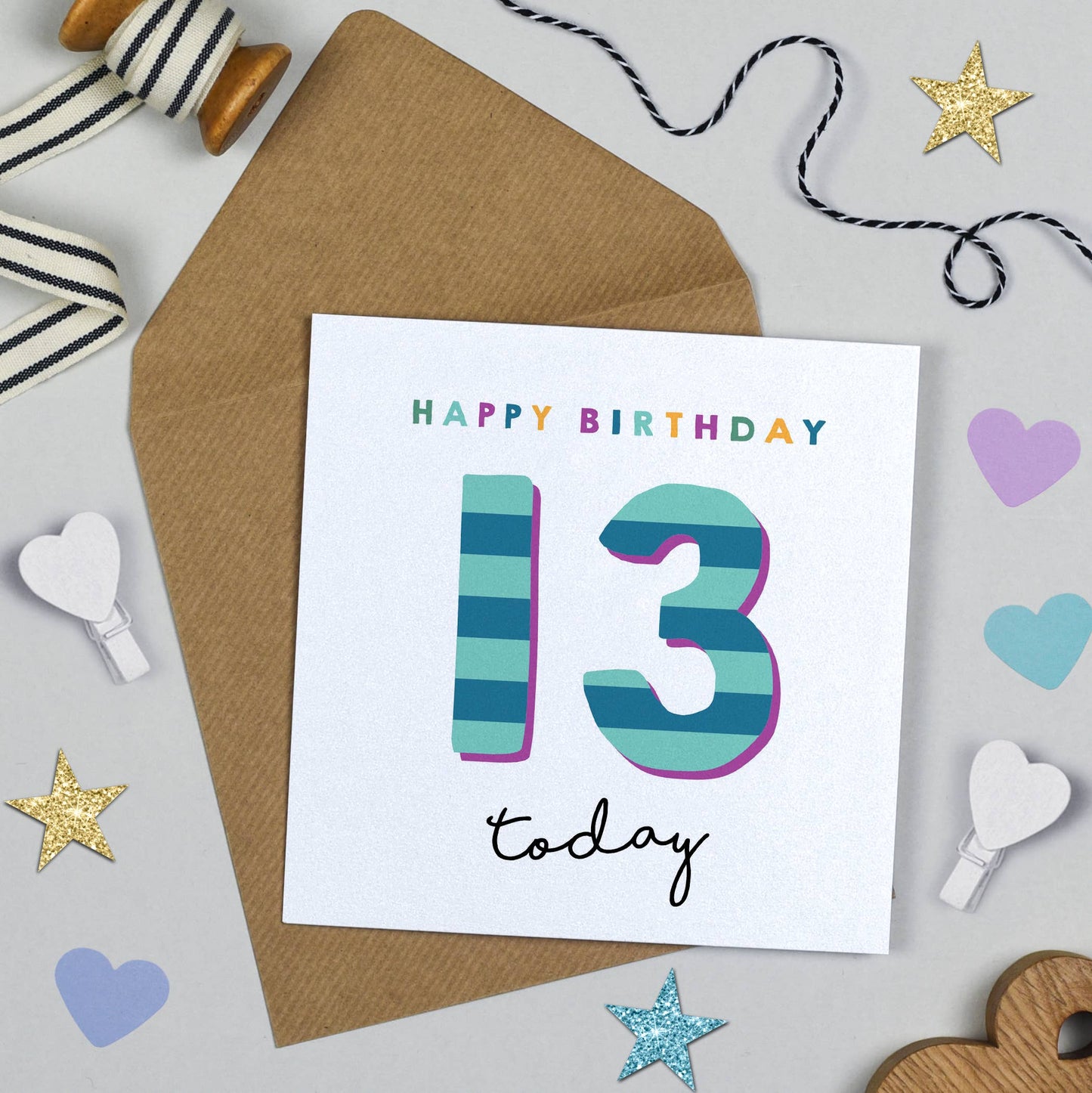 Birthday card with 'Happy Birthday 13 today' text on a white background with decorative items.