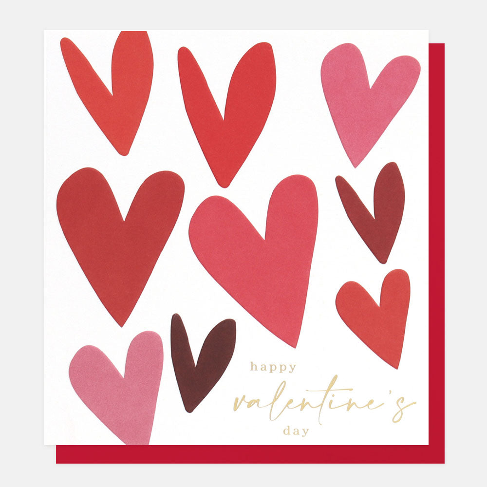 White card with hearts in different shades of red. Happy Valentines Day written in gold on the white at the bottom.