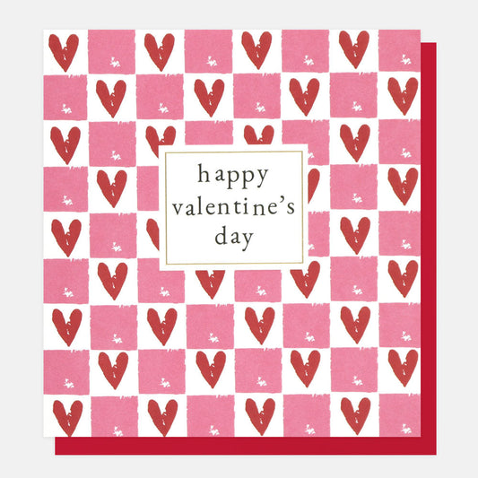 A red, white and pink card with hearts inside checked boxes and Happy Valentines Day in a white box in the centre of the card.