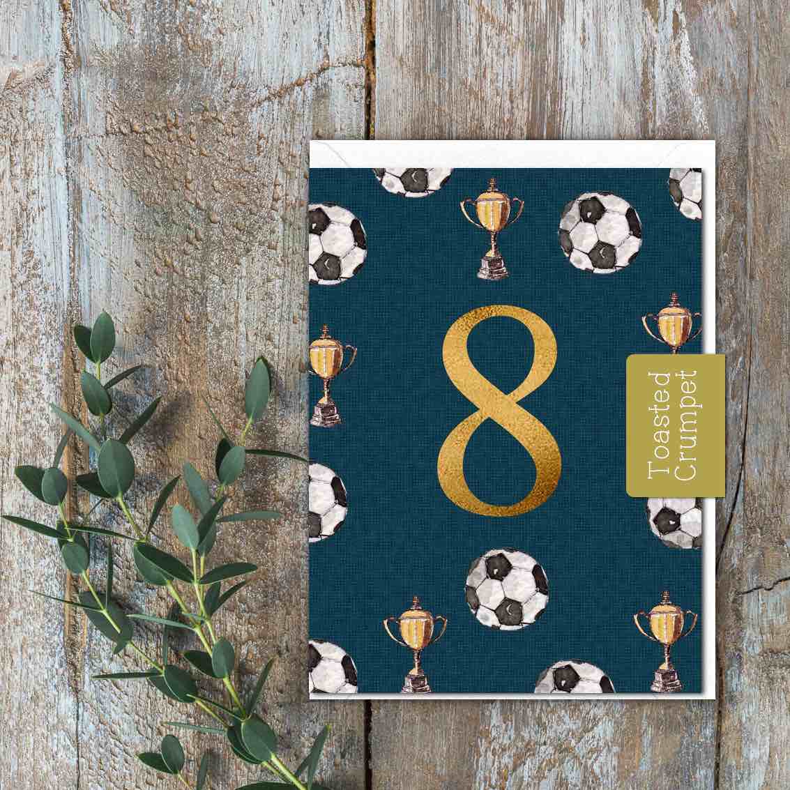 Dark green small card with 8 and footballs