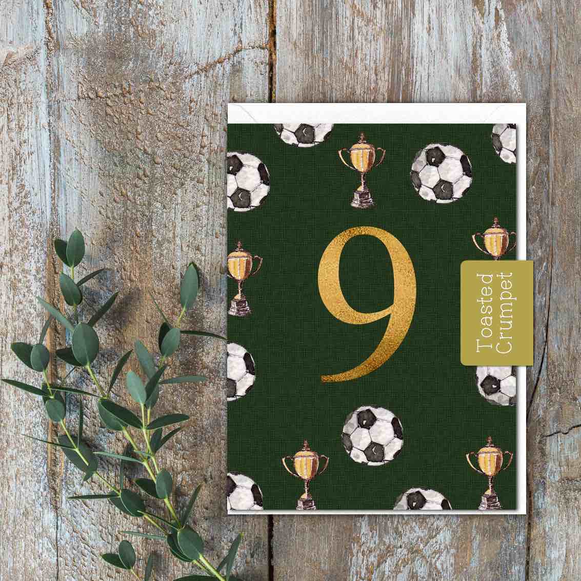 A dark green card with the number 9 and footballs on it.